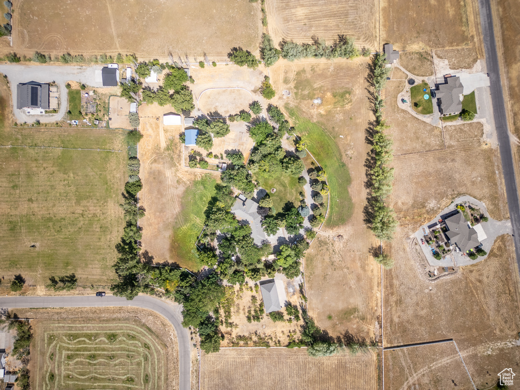 Aerial view of property and surrounding area featuring rural landscape