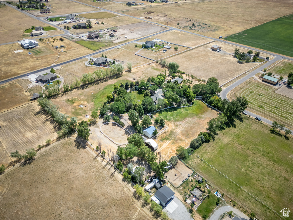 Aerial view of property and surrounding area featuring rural landscape