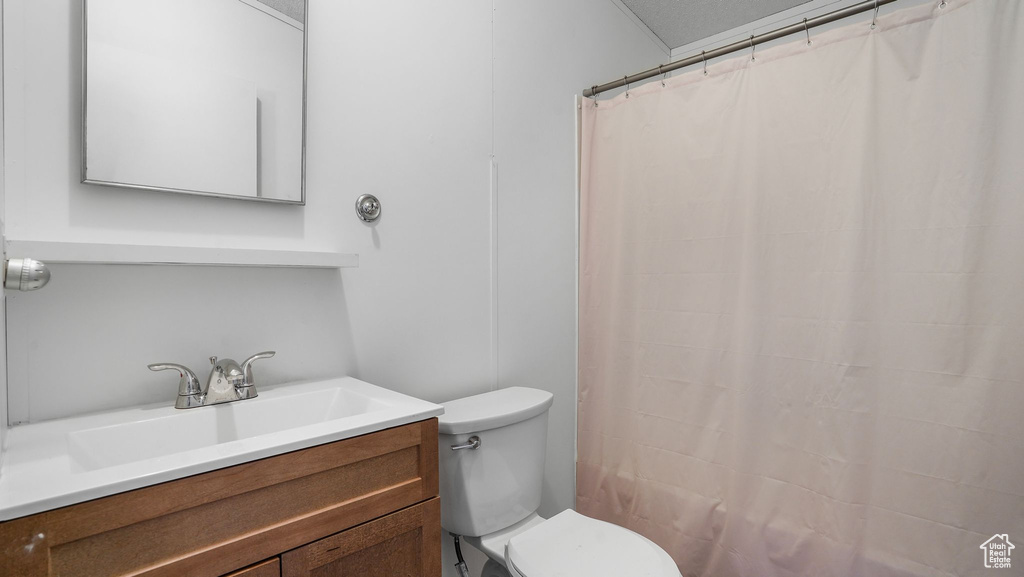 Bathroom featuring vanity and a shower with curtain
