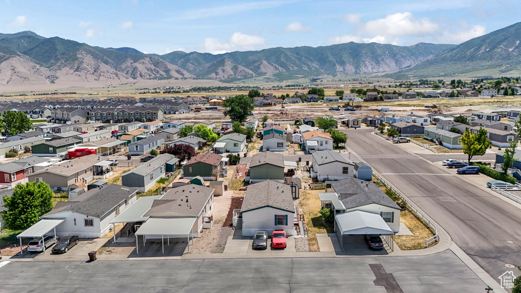 Aerial perspective of suburban area with a mountainous background