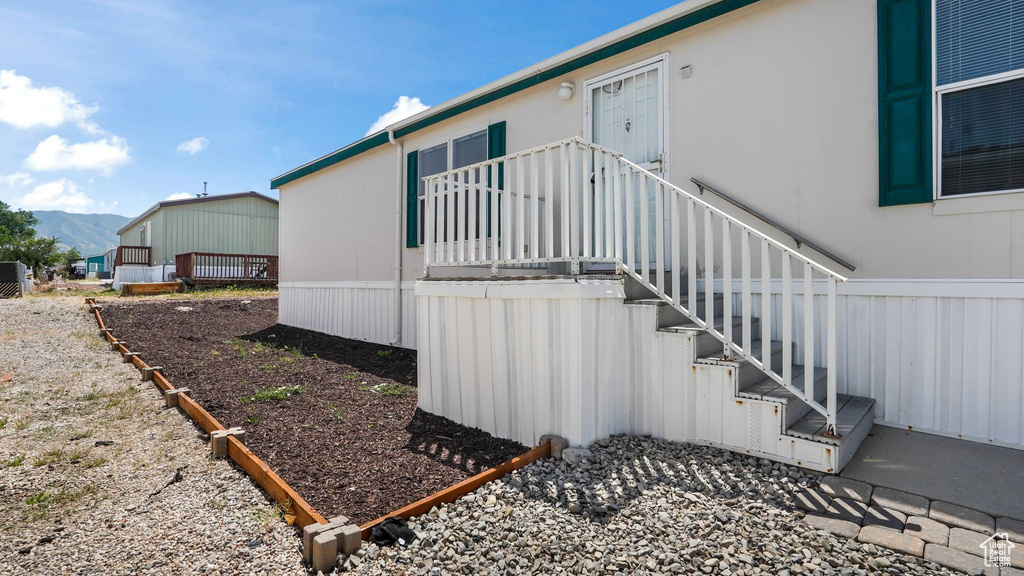 View of home\'s exterior with stairs and a mountain view