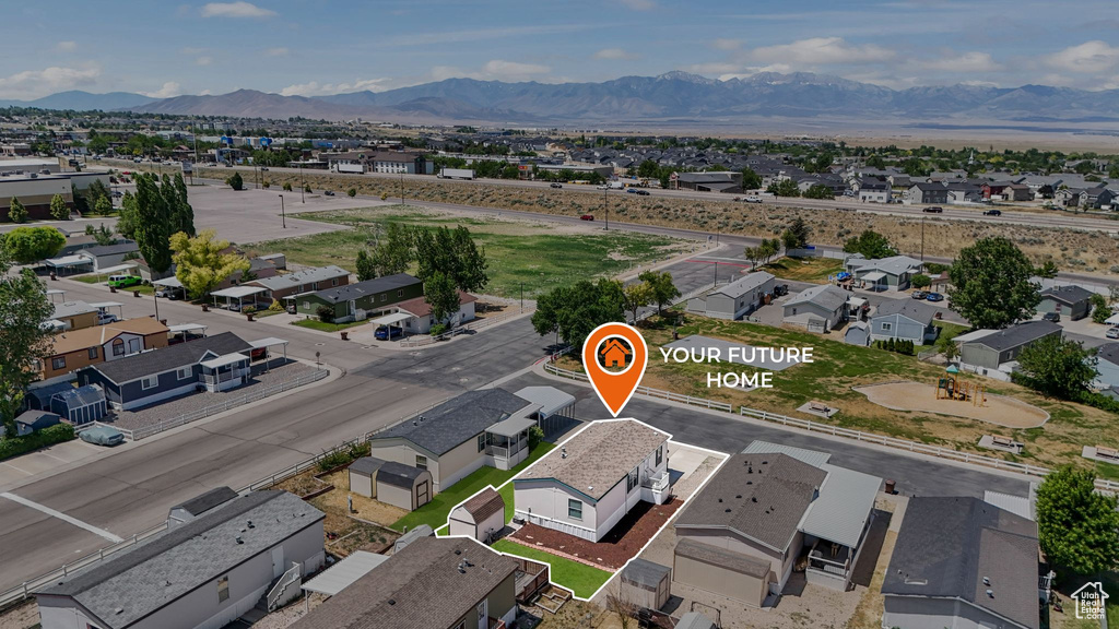 Aerial view of residential area featuring mountains