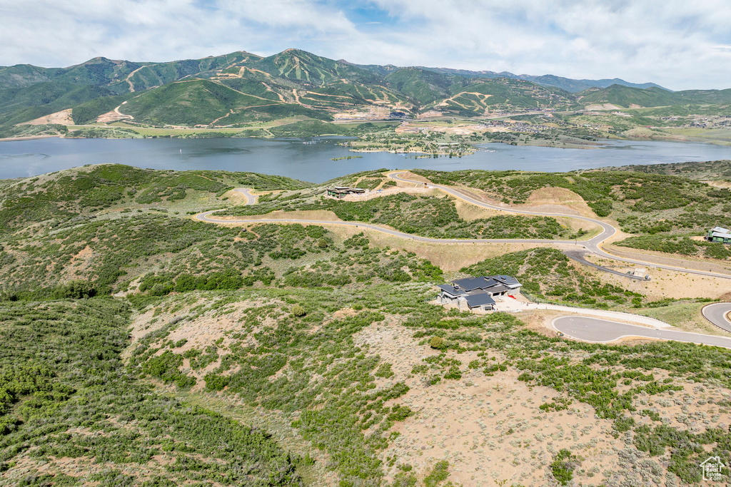 View of property location with a water and mountain view