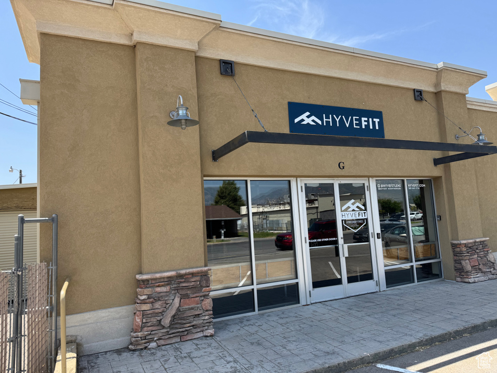 Property entrance featuring stucco siding