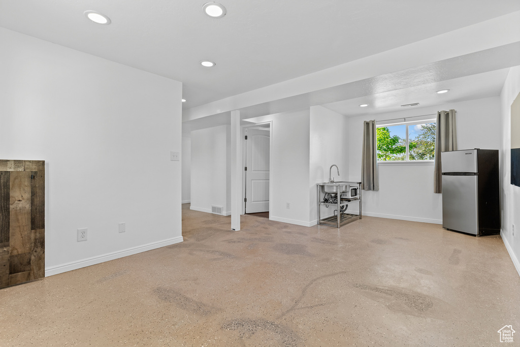 Living room with baseboards and recessed lighting
