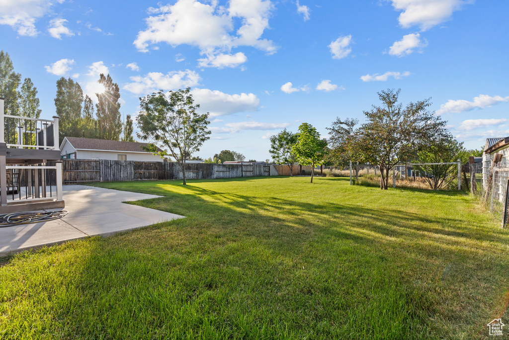 Fenced backyard featuring a patio area