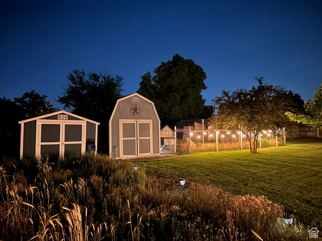 Yard at twilight with a storage shed
