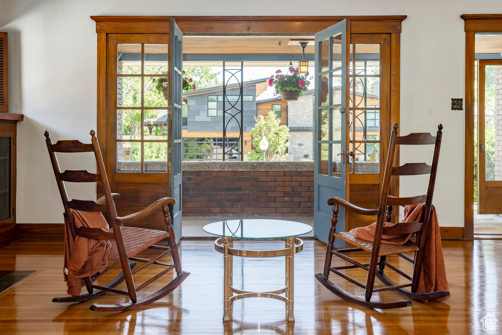 Sitting room featuring wood finished floors and french doors