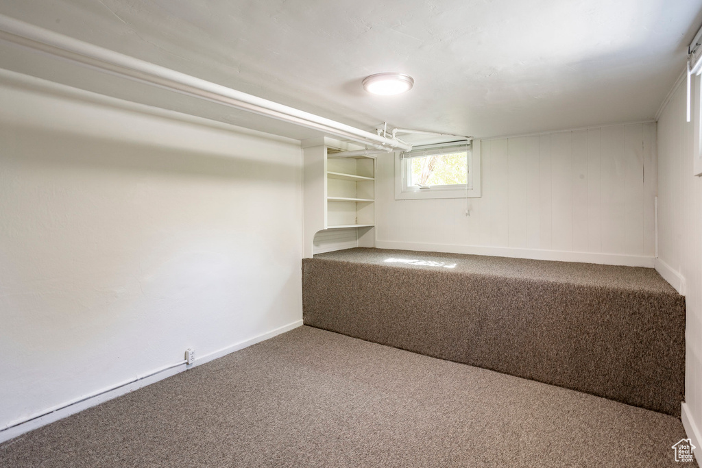 Below grade area featuring carpet floors and baseboards