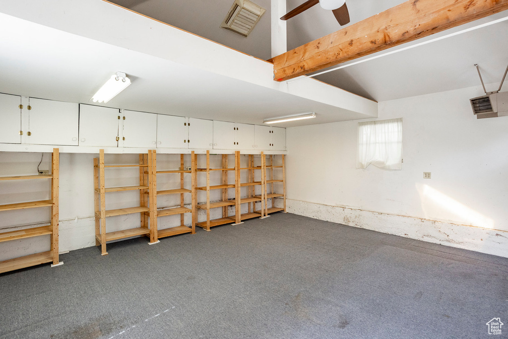 Below grade area featuring carpet and ceiling fan