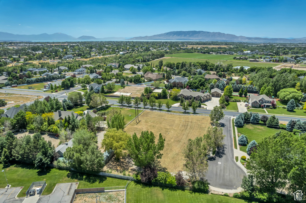 Aerial perspective of suburban area with a mountainous background