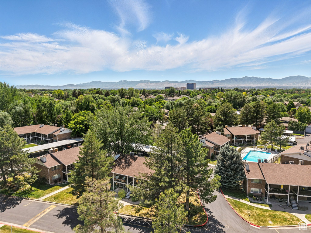 Bird's eye view of mountains and a pool area