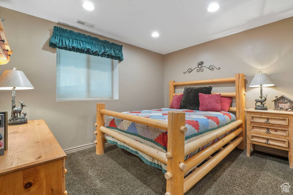 Carpeted bedroom with recessed lighting