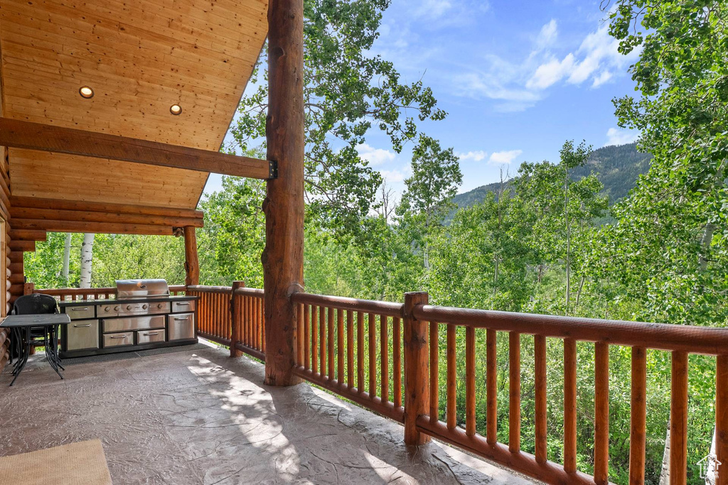 View of patio featuring an outdoor kitchen and a mountain view