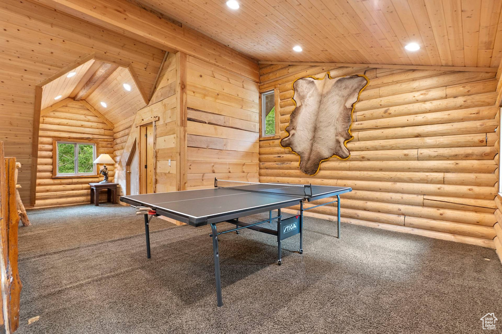 Playroom featuring rustic walls, carpet flooring, wooden ceiling, and recessed lighting