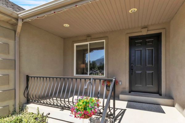 Doorway to property with stucco siding