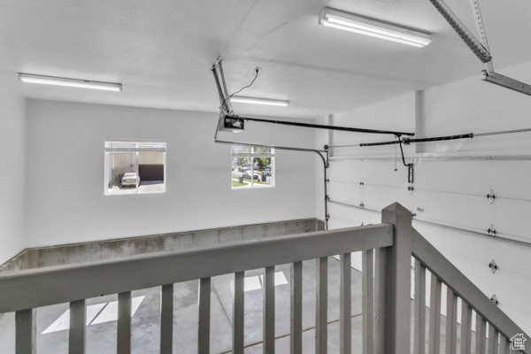 Garage featuring a garage door opener