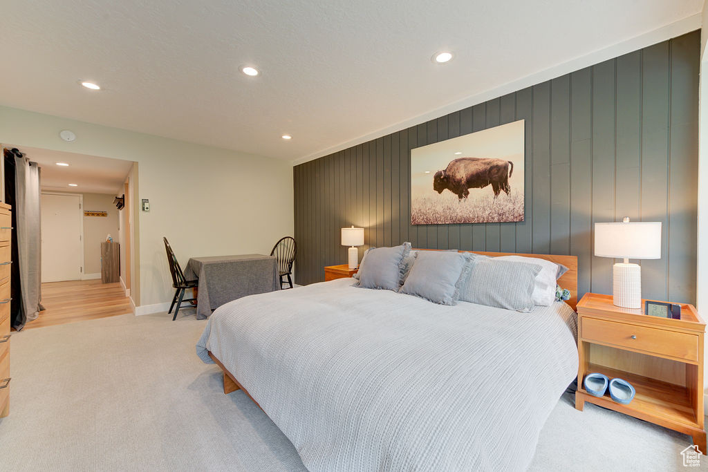 Bedroom with recessed lighting and light colored carpet