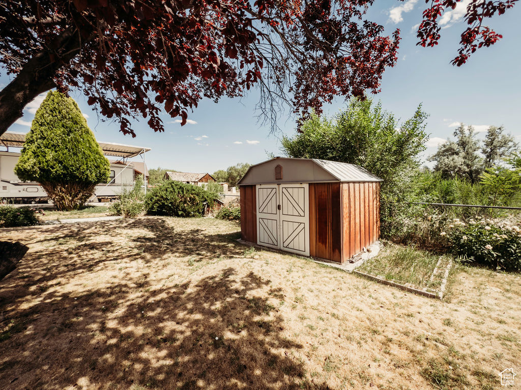 View of shed featuring a fenced backyard