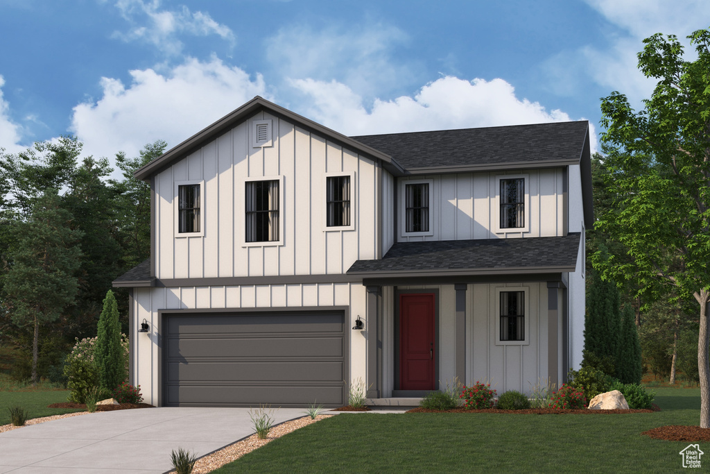View of front facade featuring board and batten siding, concrete driveway, an attached garage, and a front lawn