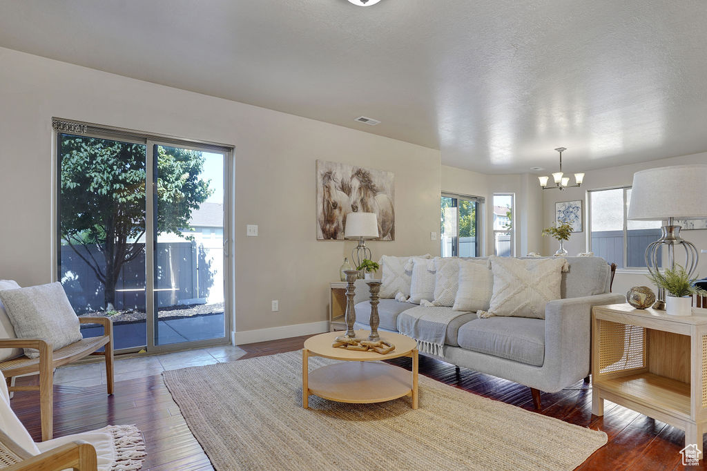Living area featuring hardwood / wood-style flooring and a chandelier
