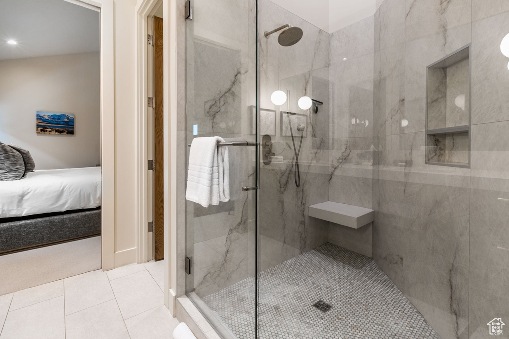 Bathroom with a stall shower, ensuite bathroom, tile patterned flooring, and recessed lighting