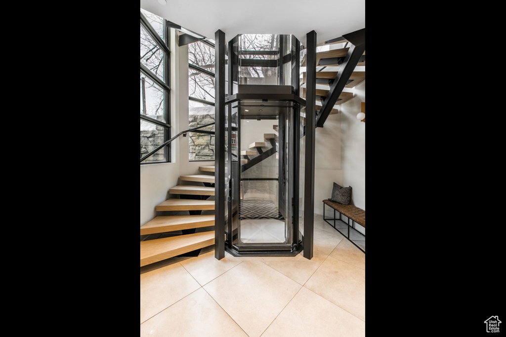 Stairway featuring tile patterned flooring
