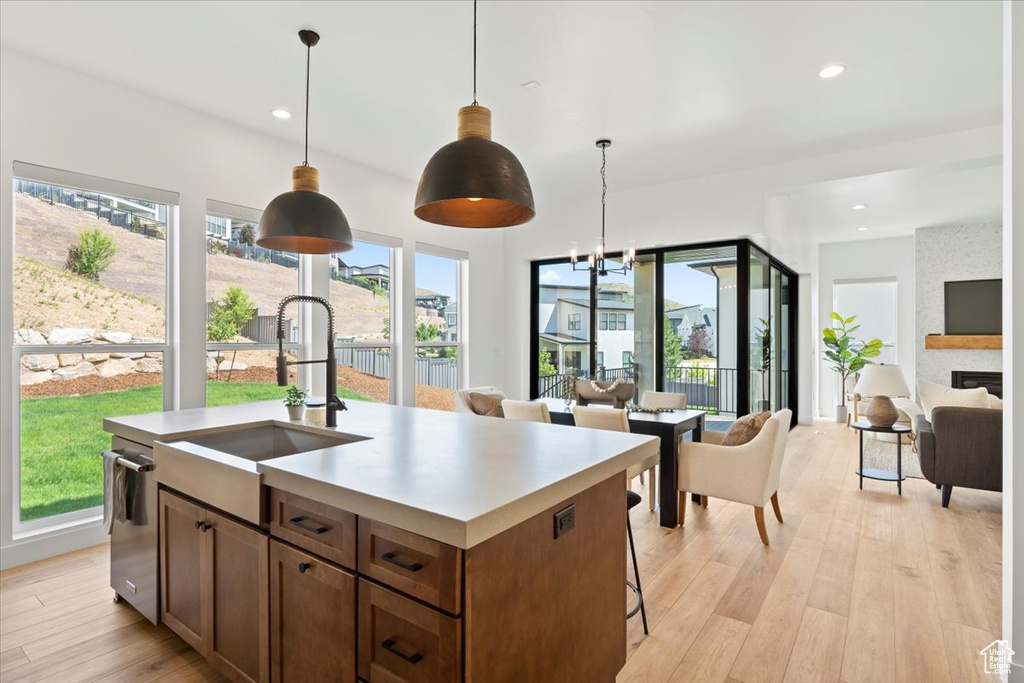 Kitchen featuring open floor plan, plenty of natural light, decorative light fixtures, and recessed lighting