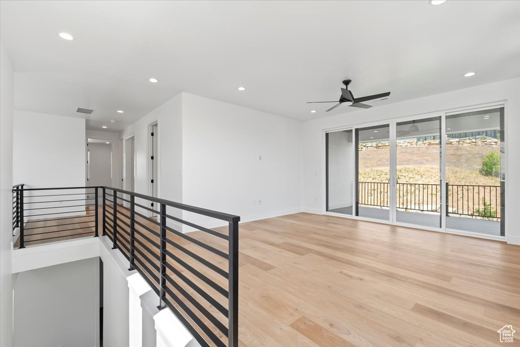 Spare room featuring light wood-style floors, recessed lighting, and ceiling fan
