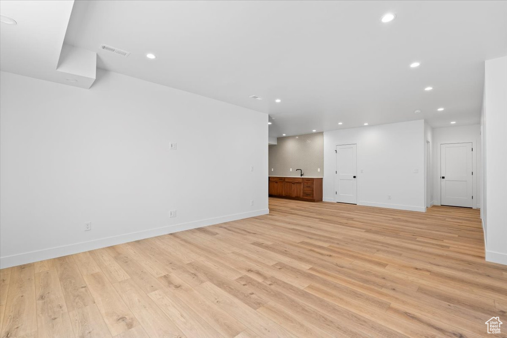 Unfurnished living room with light wood-style floors and recessed lighting