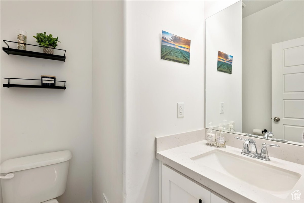 Bathroom with toilet and vanity