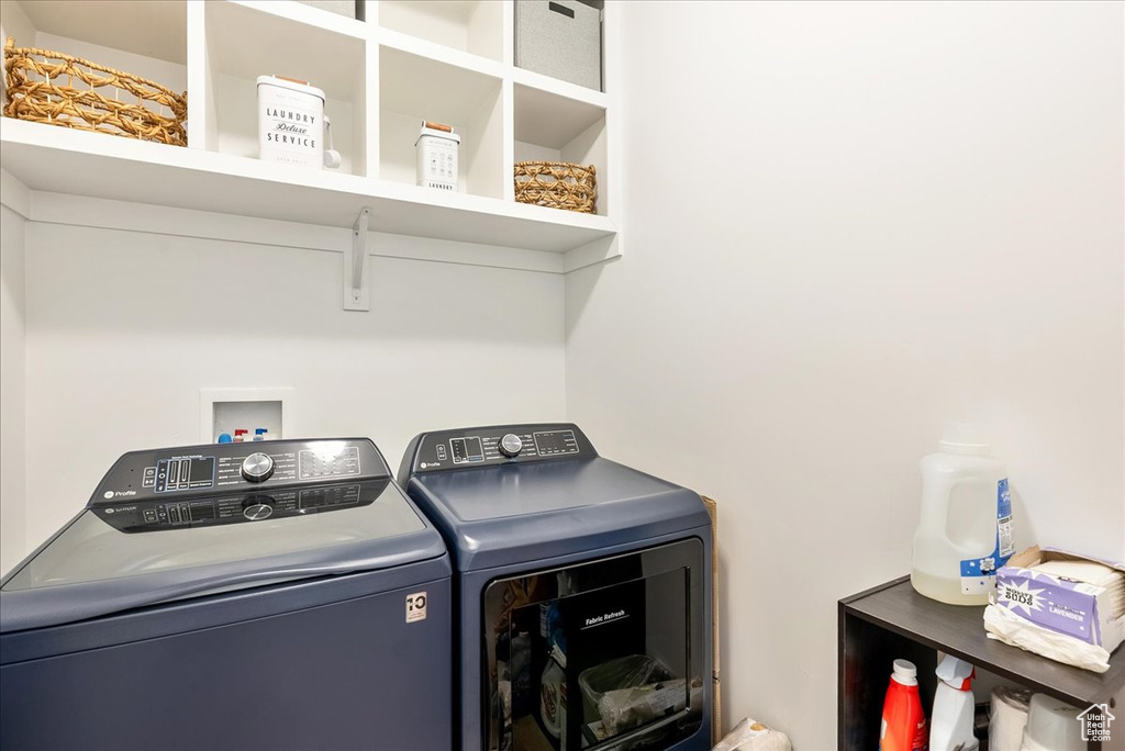 Laundry room featuring washer and clothes dryer