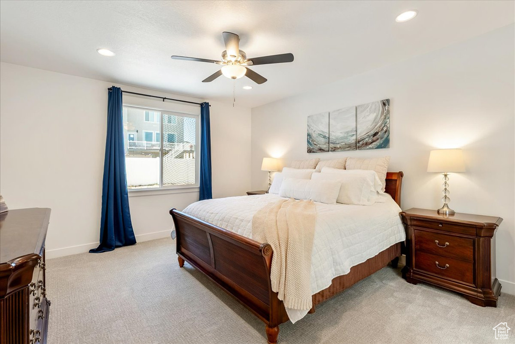 Bedroom featuring light carpet, recessed lighting, and a ceiling fan