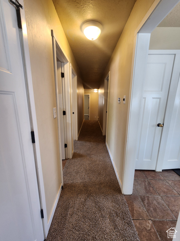 Corridor featuring baseboards