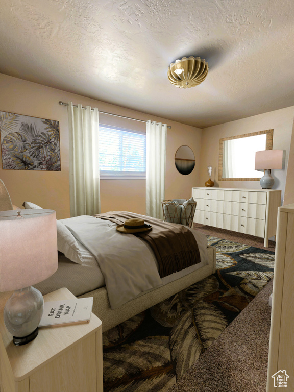 Carpeted bedroom with a textured ceiling