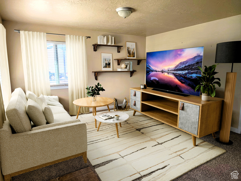 Living area featuring a textured ceiling