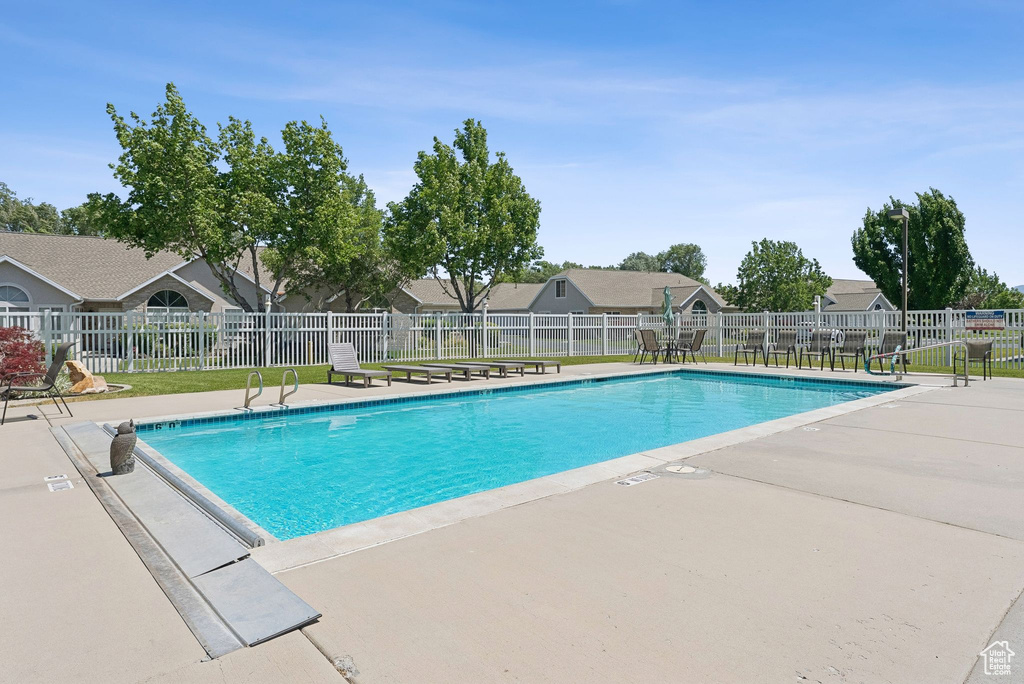 Community pool featuring a patio area