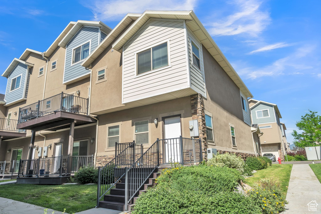 Multi unit property with stucco siding and stone siding