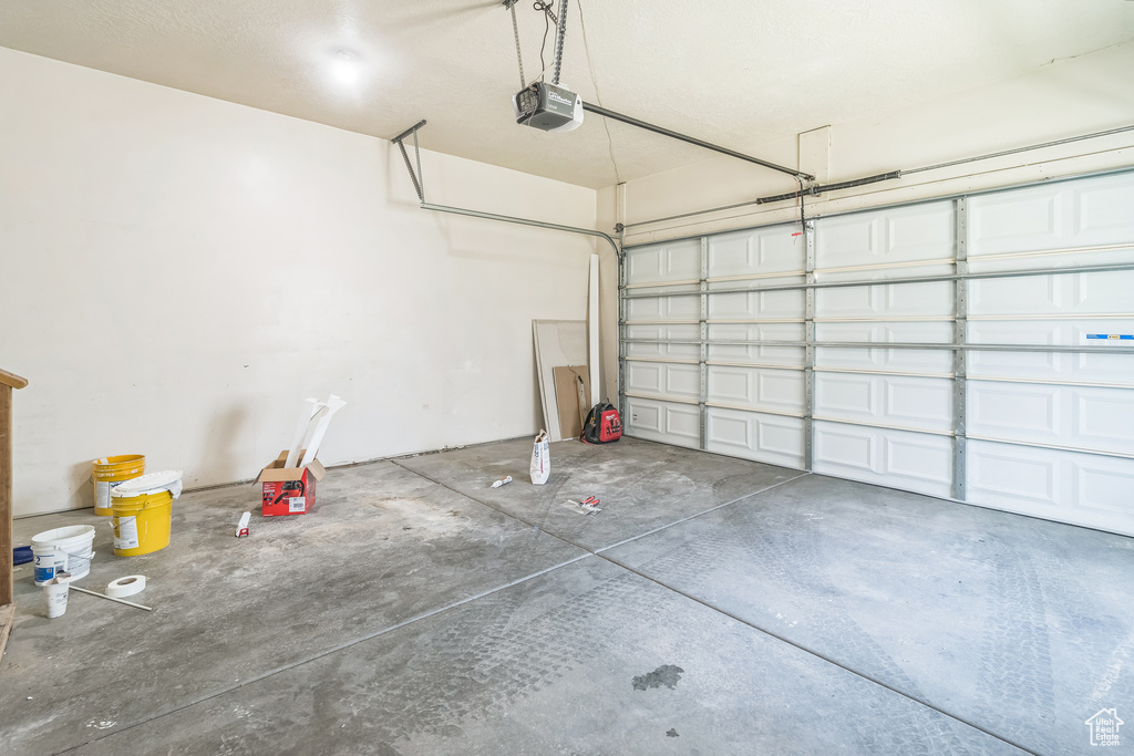 Garage featuring a garage door opener