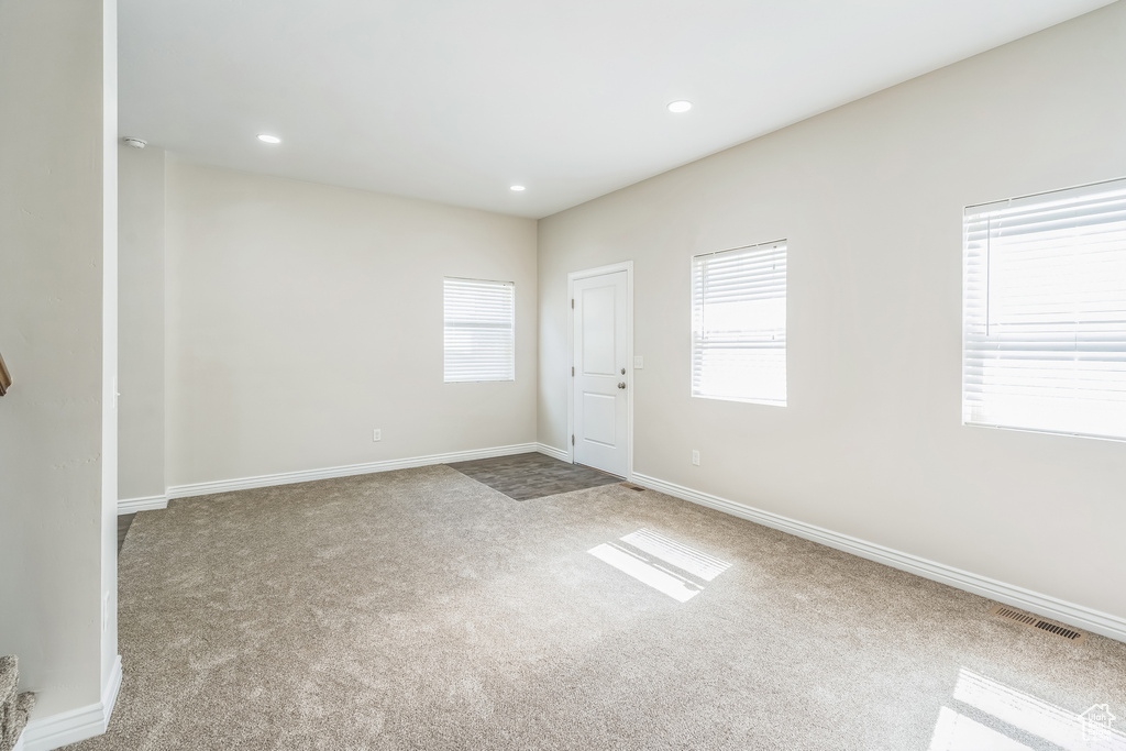 Empty room featuring carpet floors and recessed lighting