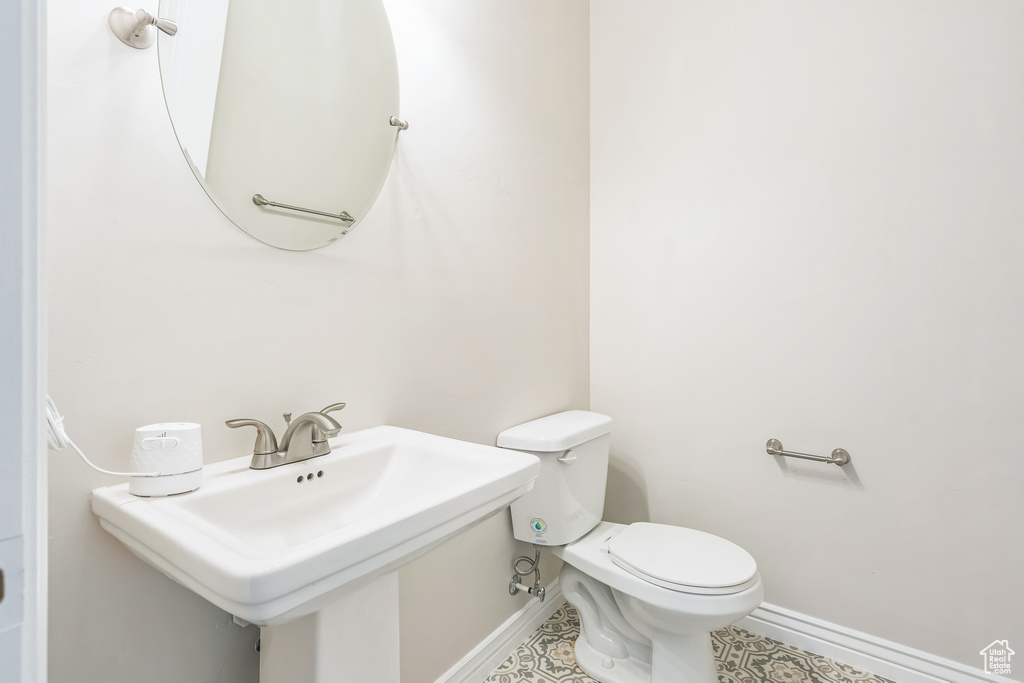 Bathroom with baseboards and toilet