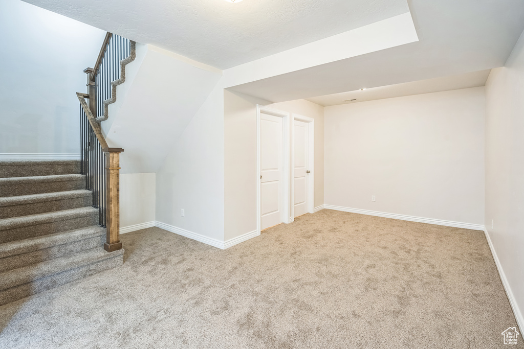 Below grade area with carpet and stairway