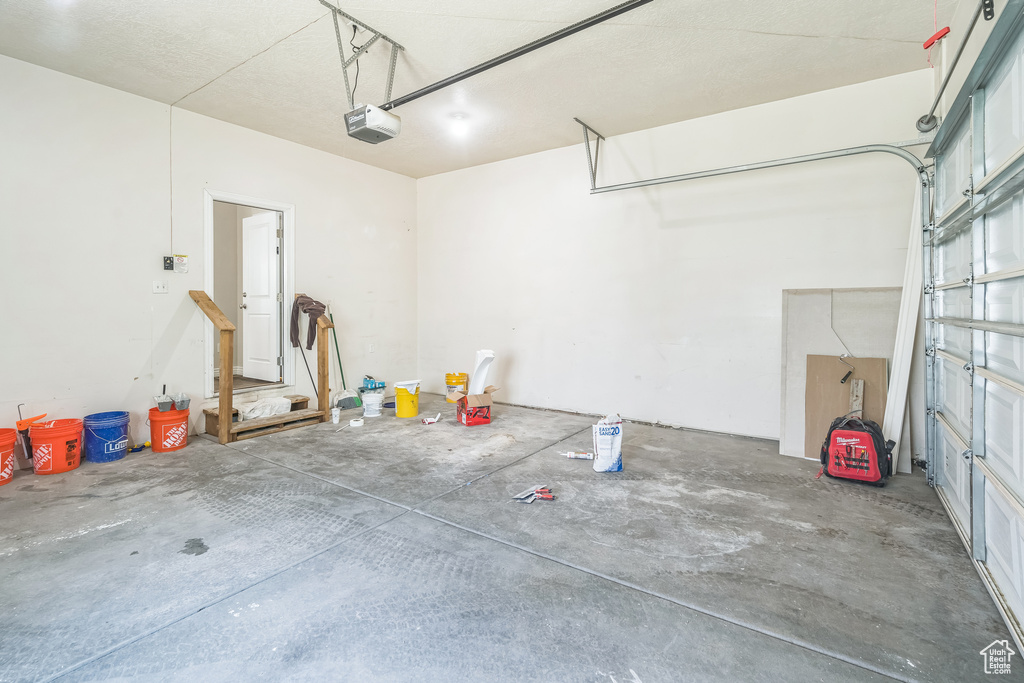 Garage featuring a garage door opener