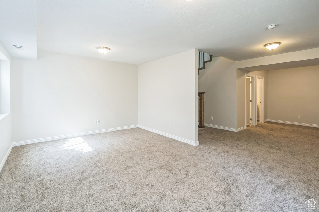 Below grade area featuring carpet flooring