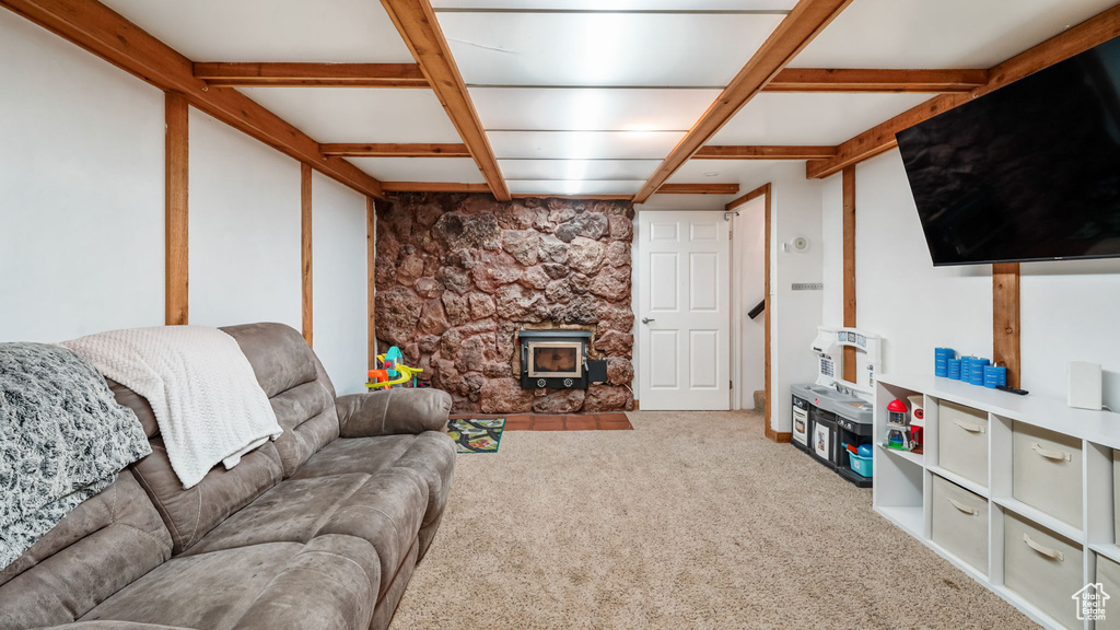 Living area with carpet floors and a wood stove