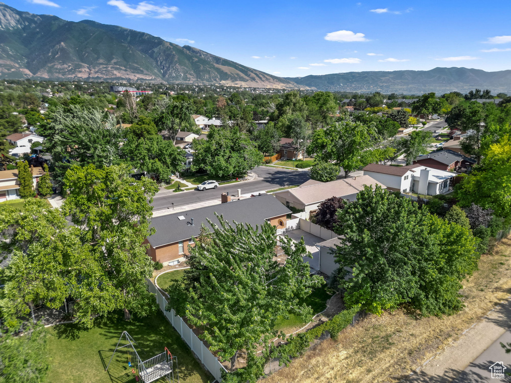 Aerial perspective of suburban area with a mountainous background