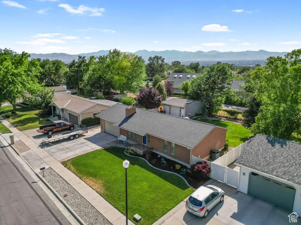 Aerial view of residential area featuring a mountainous background