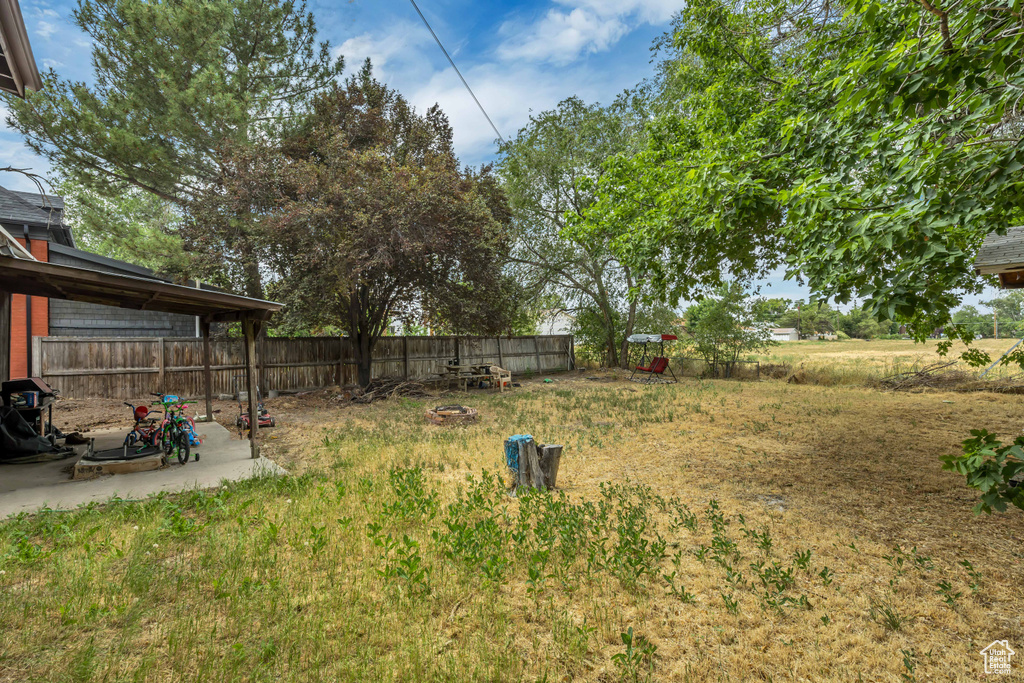 Fenced backyard with a patio