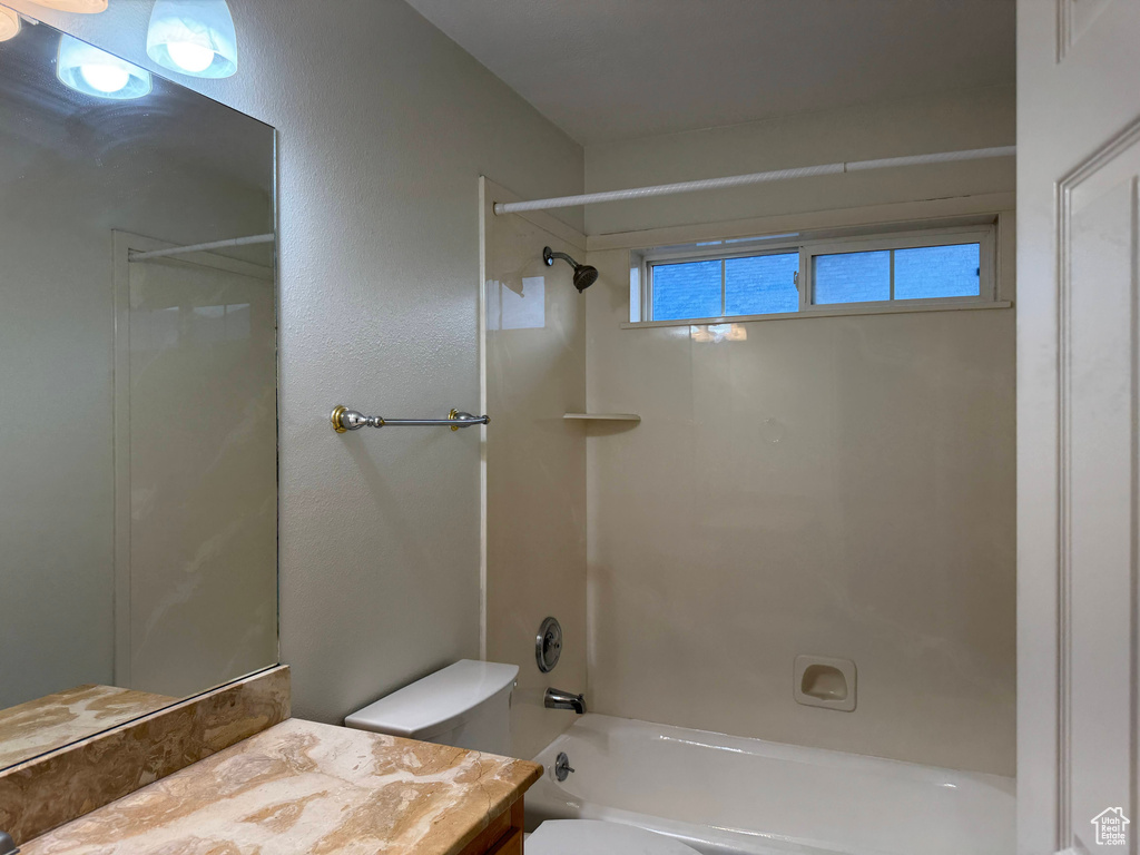 Bathroom featuring vanity and shower / bath combination