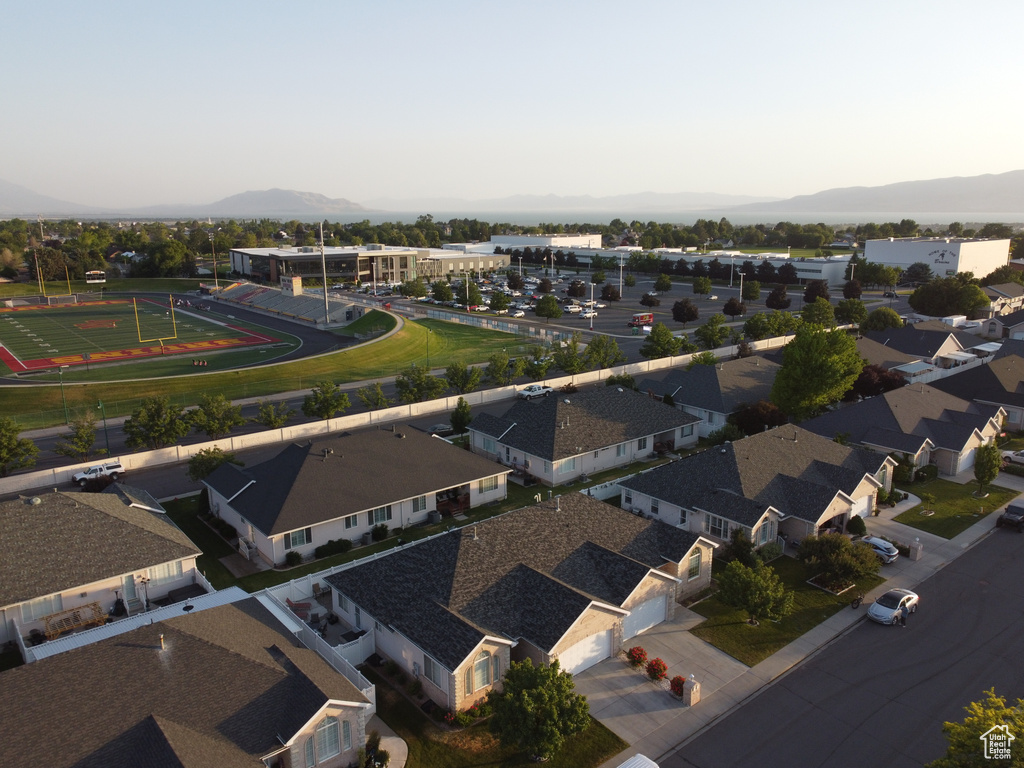 Aerial perspective of suburban area featuring a mountain backdrop